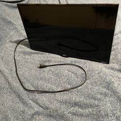 24’ Roku TV (wall mount attached)