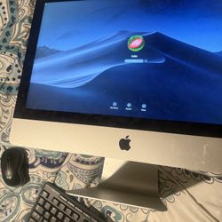 Mac Computer And Logitech Keyboard And Mouse