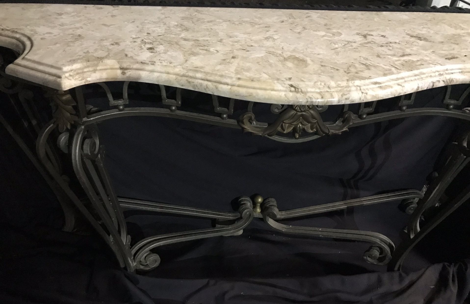 Wrought-iron table with marble top