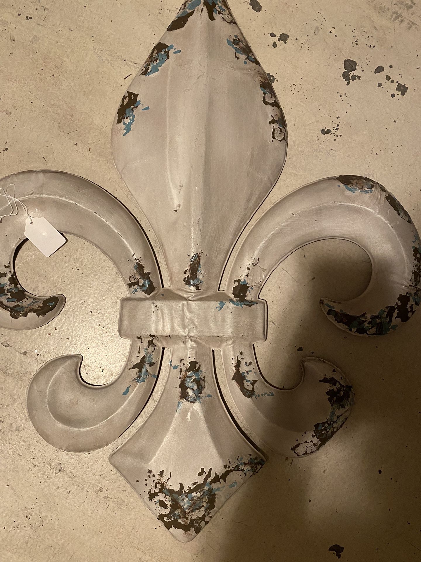 Large metal fleur-de-lis wall hanging