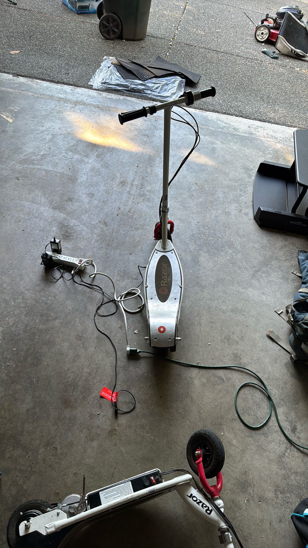 2 Razor E200 Electric Scooters Along With 3 Other Manual Scooter And Bonus Pogostick