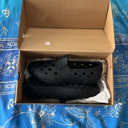 Vans Black Slip Ons