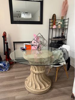 Round glass table with vintage and heavy base
