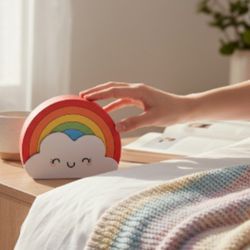 GEMS Rainbow & Cloud Smiley Face USB Rechargeable Portable Speaker New In Box. This item is a GEMS Rainbow Rechargeable Portable Speaker, as identifie