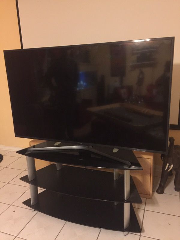 Tv Samsung 65" for parts only works but has a scream crack with tv rack new