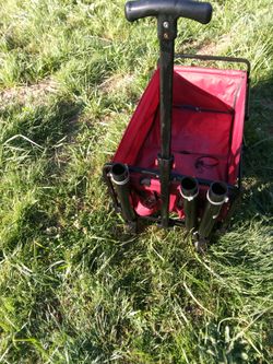 Red folding cart with drink holders.