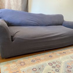 Couch with cover for sale