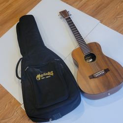 Martin LXK2 Little Martin Acoustic Guitar with bag. Pre-owned, in good 
working and cosmetic shape. It has couple of small stains on the back - 
see t