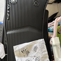 set of black all-weather rubber floor mats for a 2013-2018 Cadillac ATS.  Translation