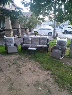 Mix matched outdoor patio furniture 3 seater couch with 2 matching rocking chairs