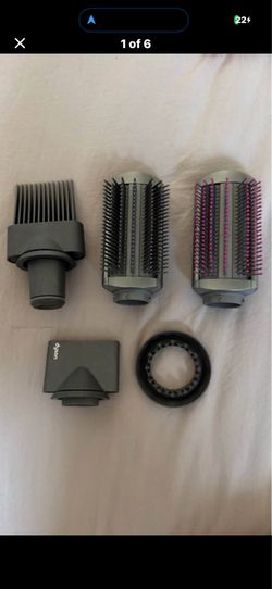 Multiple Dyson hair dryer attachments