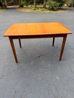 Teak extending dining table