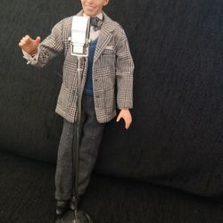 This item is a collectible Mattel 1999 Barbie Loves Frankie Sinatra Gift Set Ken doll, featuring the singer with a microphone stand
