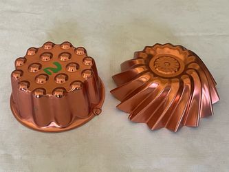 2 Vintage copper-colored aluminum jello and cake molds.