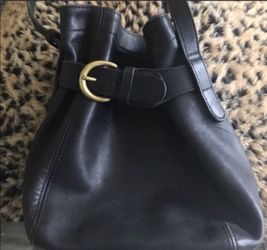 Small black leather coach bucket cross body purse 9 x 9 with a 20 inch adjustable drop strap in great condition