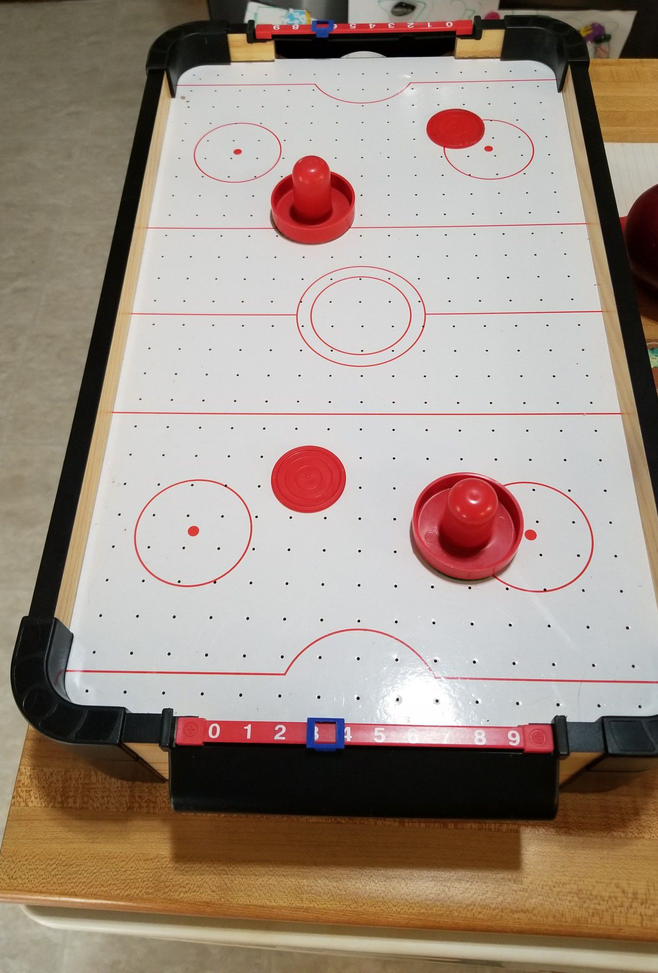 Battery operated table top air hockey game