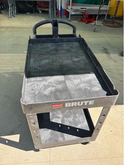 It’s a BRUTE Heavy Duty Ergo Handle Utility Cart, Lipped Shelf