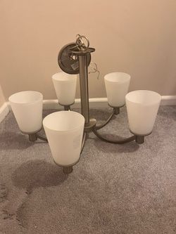 Modern 5- light chandelier with frosted glass shades $50 Cash only . Cross posted