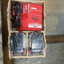  Brand new Milwaukee M18 charger with 2 Brand new 5.0ah batteries 