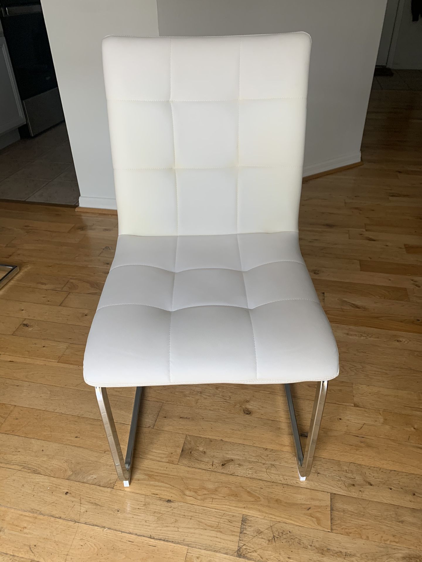 4 White Leather dining room chairs in great condition