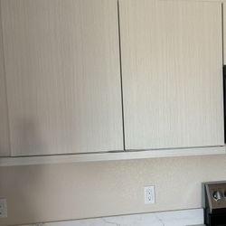 2 Tan Colored Cabinets 