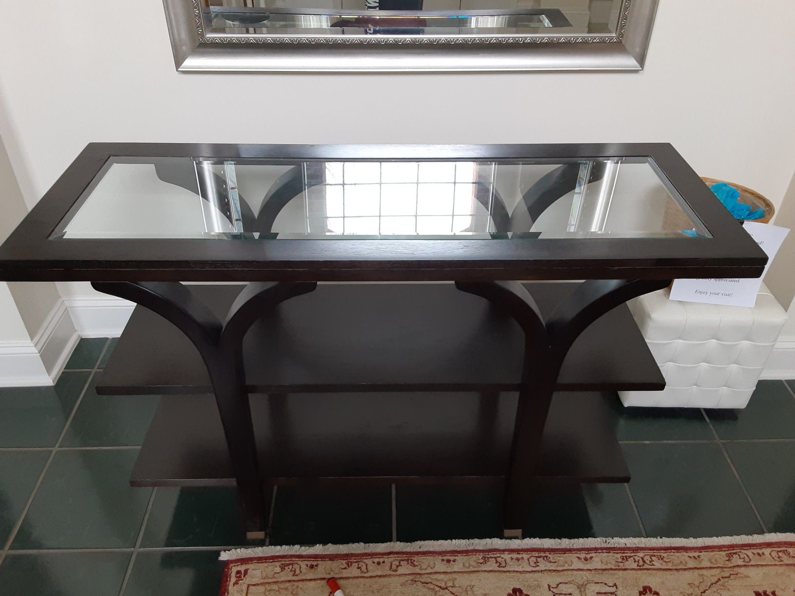 Black wooden console table with glass