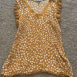 Yellow polka dot top with ruffle sleeves