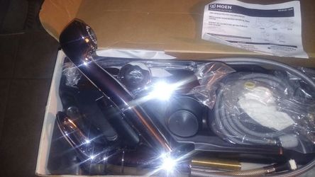Brand new still in the box Chrome Moen pull out kitchen faucet