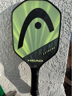 Pickle ball HEAD EXTREME ELITE paddle and 3 balls.