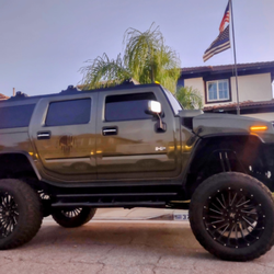 2003 Hummer H2 SUV w/115k miles. Total 8" Lift, 2"body lift, 2" torsion keys. 24" wheels on 40" tires