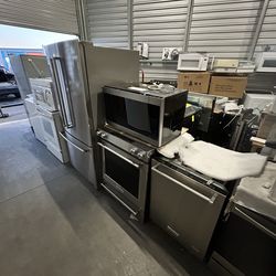 Stainless appliance set refrigerator stove microwave dishwasher