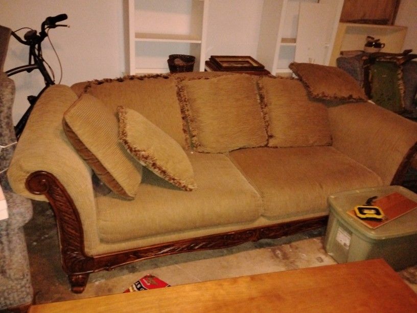 Large Couch With Wood Trim And High Back With 6 Large Pillows