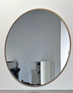 Gold round mirror