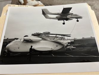 CH-53 Helicopter & a OV-10 Bronco aircraft being loaded aboard ship. 1968 black and white 8X10