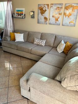 Gorgeous Beige sectional couch with deep seating from Jerome’s