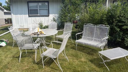 Pristine 1970s Woodard Cast Iron Patio Set bench and side table.