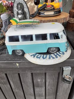 Cool metal tabletop VW bus with surfboards on top