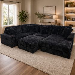 Black modular living room sectional sofa with ottoman