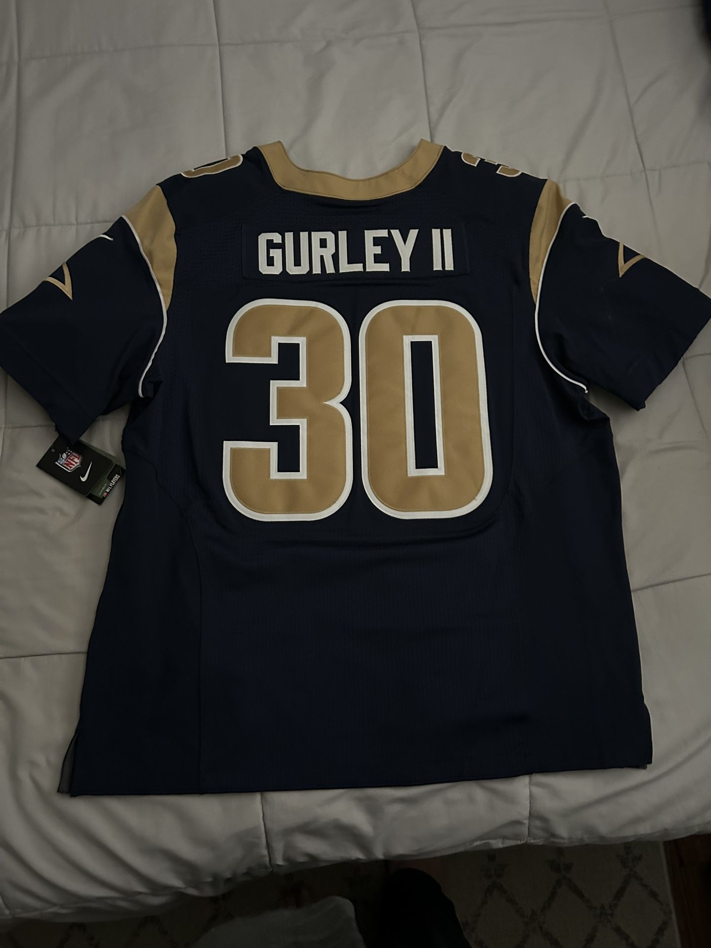 Size 52 : This is a Nike Todd Gurley II Los Angeles Rams Game Jersey in navy blue with the number 30.
