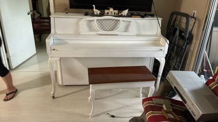 White wood piano