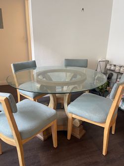 Glass table + 4 chairs