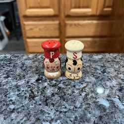 Vintage Japan Salty & Peppy Wooden Pair of Salt and Pepper Shakers.  Size approximately 2 inches tall.  Brand new never used.  