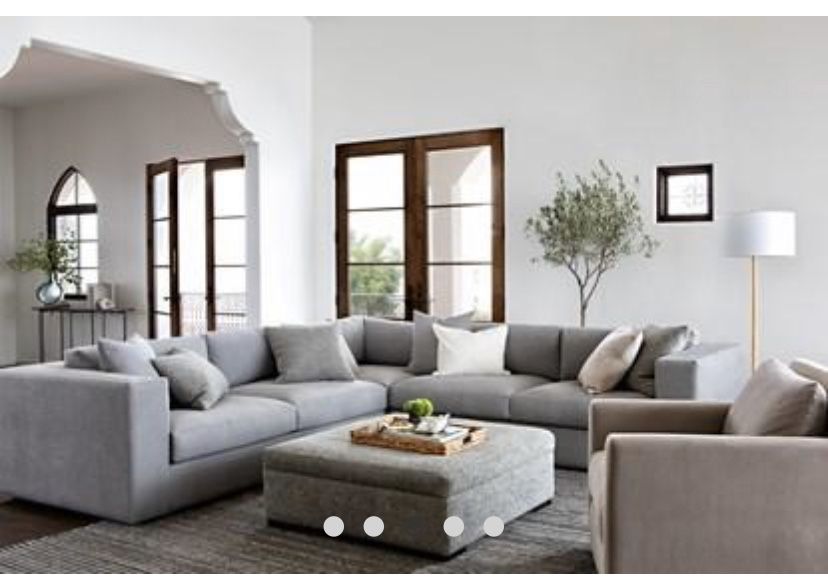 Gray sectional and ottoman Nate and Jeremiah collection