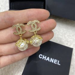 Authentic female gold pendant earrings
