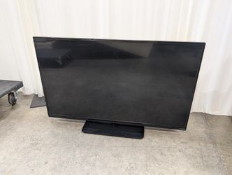 Black Flat Screen VIZIO TV with Stand