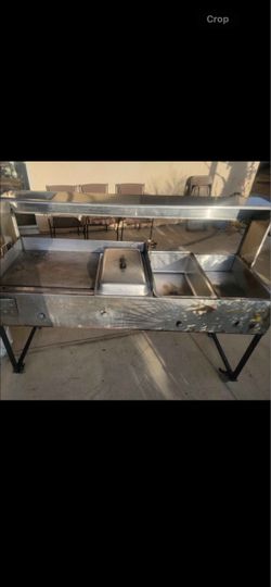 Outdoor gas grill with warmers