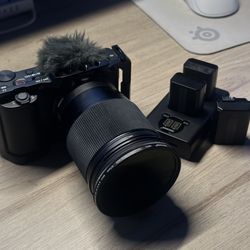 Sony ZV-E10 Camera kit + Sigma 16mm f1.4 + Cage, ND Filter + Black Diffusion Filter + Batteries