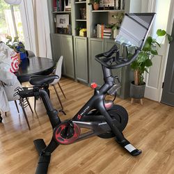 Peloton Bike with Monitor Swivel, 2 Pairs of Shoes, Mat, Weights, and iPhone Mount 