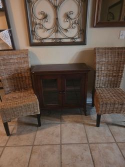 Woven chairs and bookcase