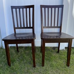 two wood dining chairs